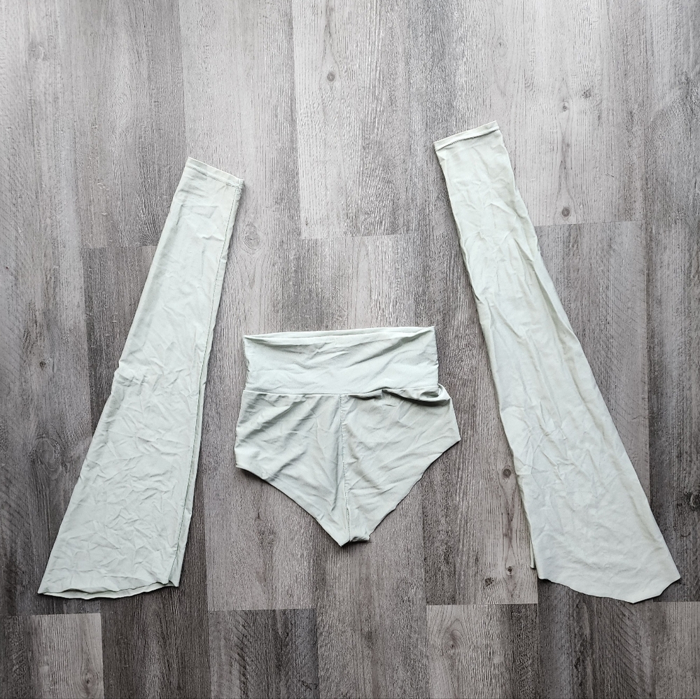 Handmade minty colored short shorts and arm sleeves